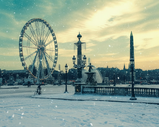 Ferris wheel and cityscape in a snowy park with a blue sky.